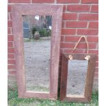 Two rectangular wall mirrors in weathered oak surrounds. H110cm W49cm D3cm (approx). Condition