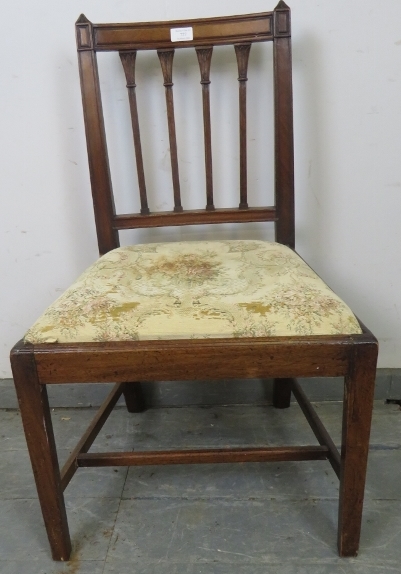 A Georgian oak occasional chair with carved finials and spindles, on tapering square supports with