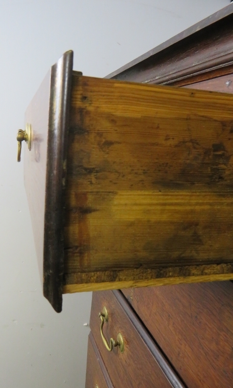 An 18th century oak chest on stand, housing two short over three long drawers with brass batwing - Image 3 of 4