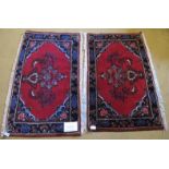 A fine pair of unused Mehraban (Hamadan region) mats. Ruby field with vase of flower motif and
