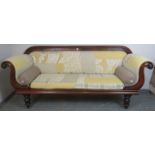 A Victorian mahogany show-wood sofa, with scrolled arms, reupholstered in contemporary patchwork