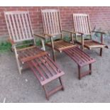 Three 20th century teak folding steamer chairs, two with associated footrests.
