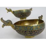 A pair of Persian/Islamic gilt brass ceremonial bowls, each of elliptical/boat form with twin