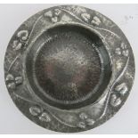 Liberty's English pewter Arts & Crafts shallow dish of circular form with embossed and planished