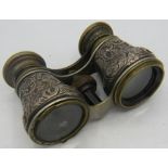 A pair of heavily embossed silver binoculars. Birmingham 1890. Condition report: Part of the rim