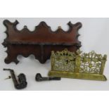 An ornate Edwardian mahogany pipe rack, a cast brass aesthetic movement pipe rack and two tobacco