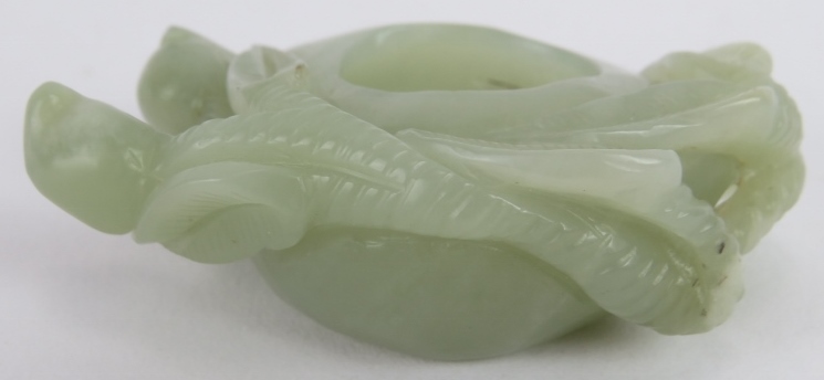 A Chinese carved celadon Jade brush washer, of leaf and stem form, Ming style but likely Qing, 7cm - Image 2 of 4