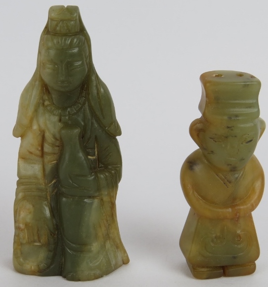 Two Chinese carved celadon and pale celadon striated figures of a Goddess, 8.5cm high, and male