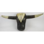 African carved wood cow head mask, paint and pigment, 15" height x 31" wide. Condition report: