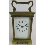 An early 20th century brass cased carriage clock, 12cm high. Condition report: White enamel dial