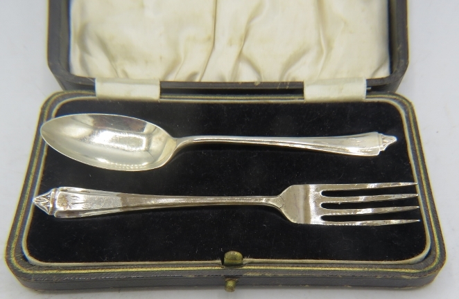 A silver christening spoon and fork. Sheffield 1938. 1.2 troy oz/37 grams. Boxed. Condition