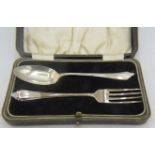 A silver christening spoon and fork. Sheffield 1938. 1.2 troy oz/37 grams. Boxed. Condition