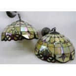 A pair of stylish Tiffany style ceiling pendant lights. Decorated in the traditional leaded-light