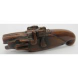 A novelty treen carved wood dual barrel flintlock pistol snuff box, early 19th century. Incorporated