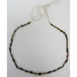 A Viking beaded glass necklace, circa 11th century. Restrung in recent years. 16.9 in (43 cm) length