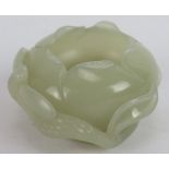 A Chinese carved celadon Jade brush washer, of intricate organic naturalistic form, with leaf and