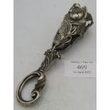 A white metal posy holder, decorated with roses. Condition report: Good condition.