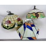 Three stylish Tiffany style ceiling pendant lights. Decorated in the traditional leaded-light and