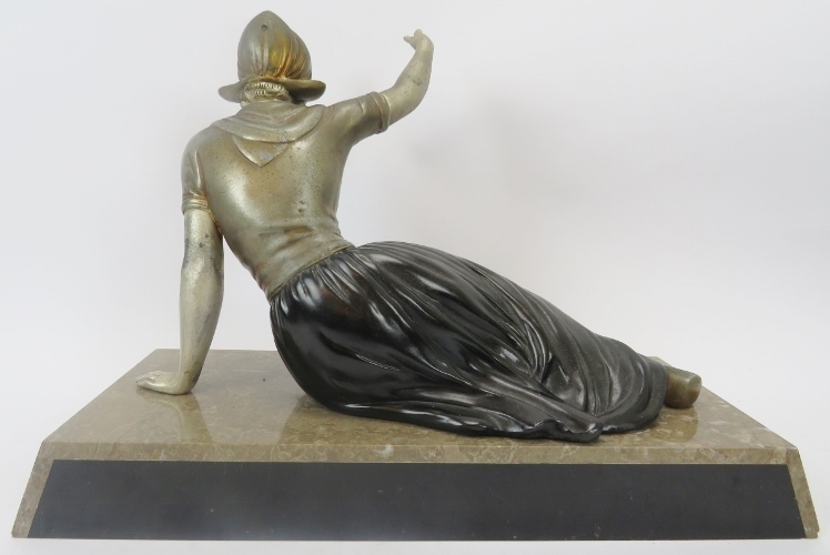 A French Art Deco polychrome decorated spelter figure of a Dutch female. Mounted on a marble and - Image 2 of 2