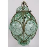 An Italian Seguso Murano glass pendant lamp, circa 1960s. Hand blown into a wire cage with pale