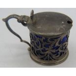 A drum shaped mustard pot with openwork sides and blue liner. Chester 1907. Condition report: Some