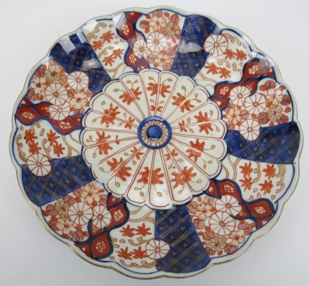 A group of Japanese ceramics. Comprising a blue and white dish, 32cm diameter, an Imari fluted dish, - Image 7 of 11