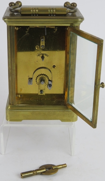 A brass cased 8 day carriage clock with white enamel dial. Overall height: 16cm. Key present. - Image 3 of 3