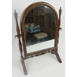 Mahogany swing toilet mirror. Dome top to mirror between turned supports. 17.5 in (44 cm) height x