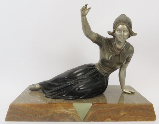 A French Art Deco polychrome decorated spelter figure of a Dutch female. Mounted on a marble and