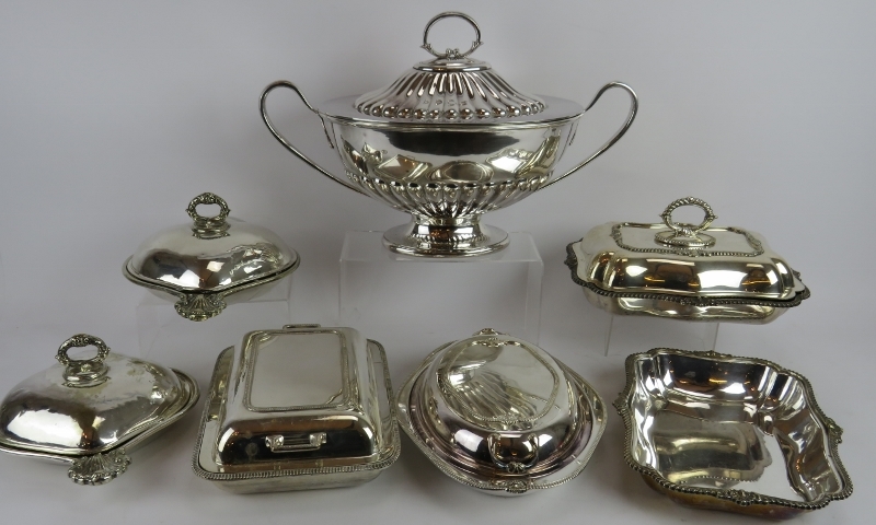A large Georgian style silver plated tureen, a pair of scallop shaped serving dishes and four