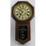 American Ansonia drop dial wall clock, 19th century. The movement strikes on a gong. Key and