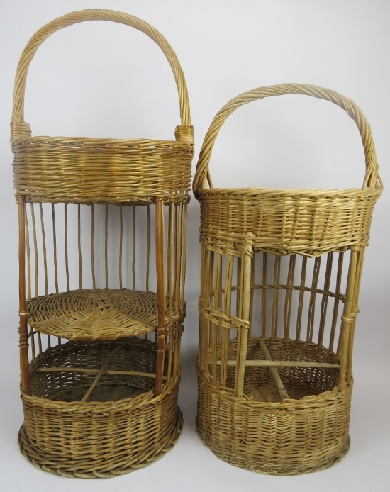 Two French hand woven wicker multi-tier picnic baskets. Both with compartmented lower sections. 34