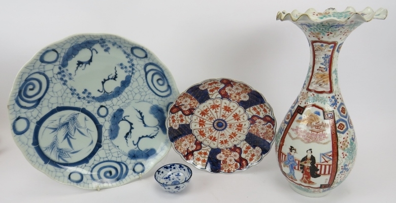 A group of Japanese ceramics. Comprising a blue and white dish, 32cm diameter, an Imari fluted dish,