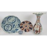 A group of Japanese ceramics. Comprising a blue and white dish, 32cm diameter, an Imari fluted dish,