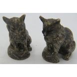 A pair of novelty silver pepperettes, German, Hanau. In the shape of sitting cats.