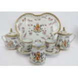 A Samson armorial Famille rose ceramic tea set, 19th century. Comprising a tray, teapot, sugar bowl,