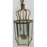 A Georgian revival gilt-brass hexagonal hanging lantern with clear glass panels. Approx 19.7 in (