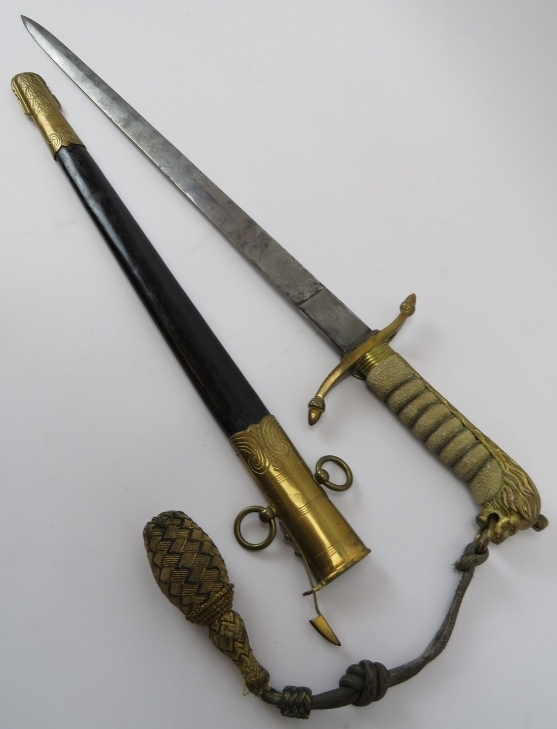 A George VI Royal Navy Midshipman's dirk and scabbard. Engraved blade with shagreen handle, lions