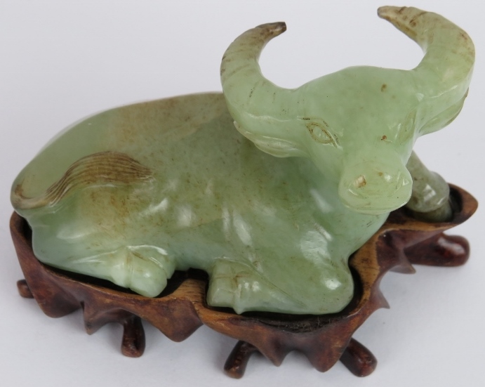 A Chinese carved celadon Jade recumbent water Buffalo, Ming style but likely Qing, resting on a - Image 2 of 4