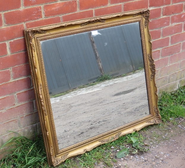 A 19th century style rectangular wall mirror in moulded gilt gesso frame. H78cm W88cm D5cm (approx). - Image 2 of 2