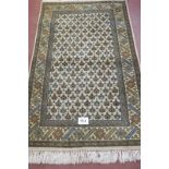 A 20th century wool rug, Persian design. 220cm x 130cm. Condition report: In very good condition.