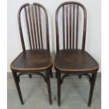 A pair of vintage bistro style bentwood occasional chairs with stamped seats in an alligator skin