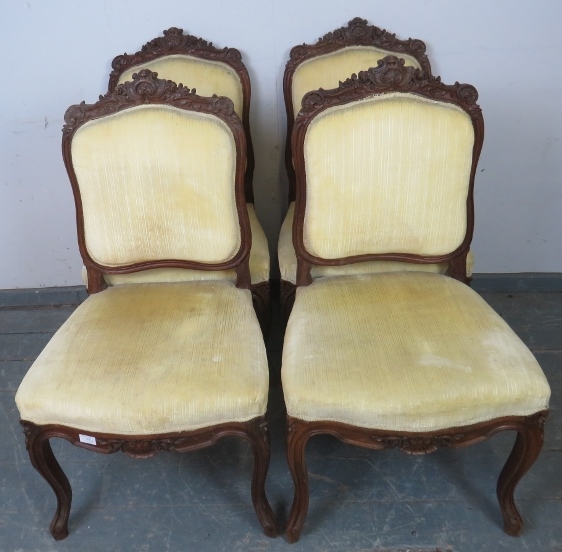 A set of four 19th century French dining chairs, the ornately carved cornices with acanthus scrolls,