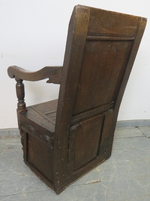 A 17th century and later oak wainscot chair, with relief carved panel back, above a box base with - Image 3 of 3
