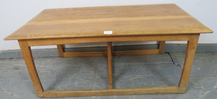 A heavy Art Deco Period light oak coffee table in the manner of Heal’s, on rail supports with a