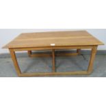 A heavy Art Deco Period light oak coffee table in the manner of Heal’s, on rail supports with a