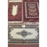 Three rugs, to include a Persian and wool rugs. Largest rug 130cm x 80cm. Condition report: In clean