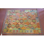 Anatolian Turkish Kilim geometric pattern of sumptuous reds, greens and yellows, fringe. 198cm x