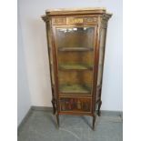 An antique French mahogany ormolu mounted vitrine in the manner of Vernis Martin with white marble