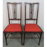A pair of Edwardian mahogany side chairs, strung with satinwood, the seats upholstered with